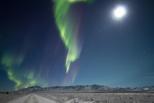 time lapse photography of aurora borealis under full moon HD wallpaper