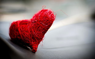 shallow focus photography of heart yarn