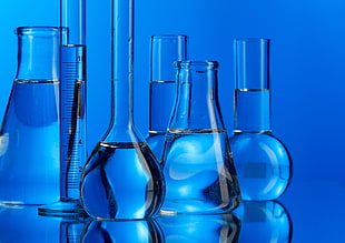 six glass bottled filled with water