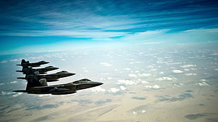photo of four brown jet fighter