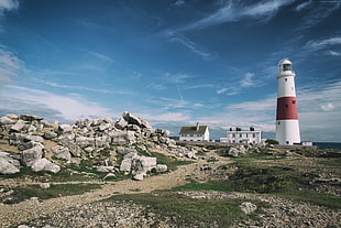 white and red lighthouse during daytime
