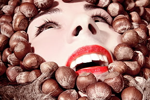 woman with red lipstick drowned in nuts