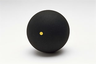 black ball with yellow dot