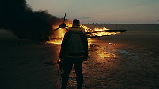 person near burning plane