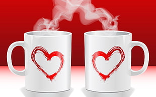 two white-and-red ceramic mugs