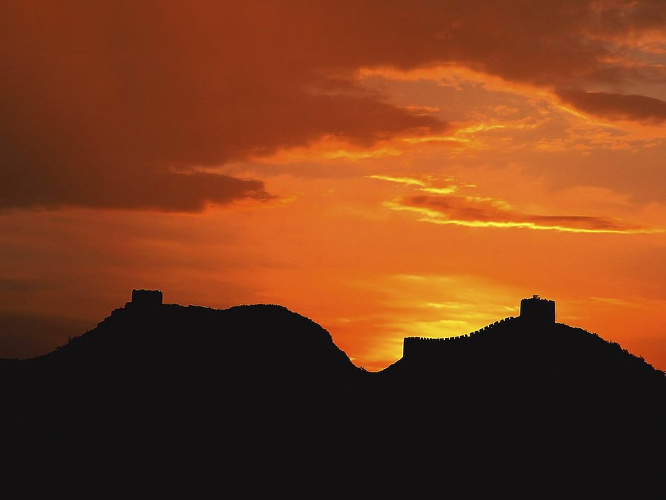 silhouette of mountain during sunset HD wallpaper