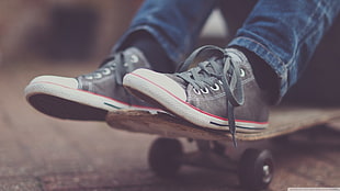 pair of gray-and-white sneakers, skateboard, shoes, jeans, blurred