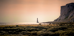 Lighthouse near shore during daytime, beachy head lighthouse HD wallpaper