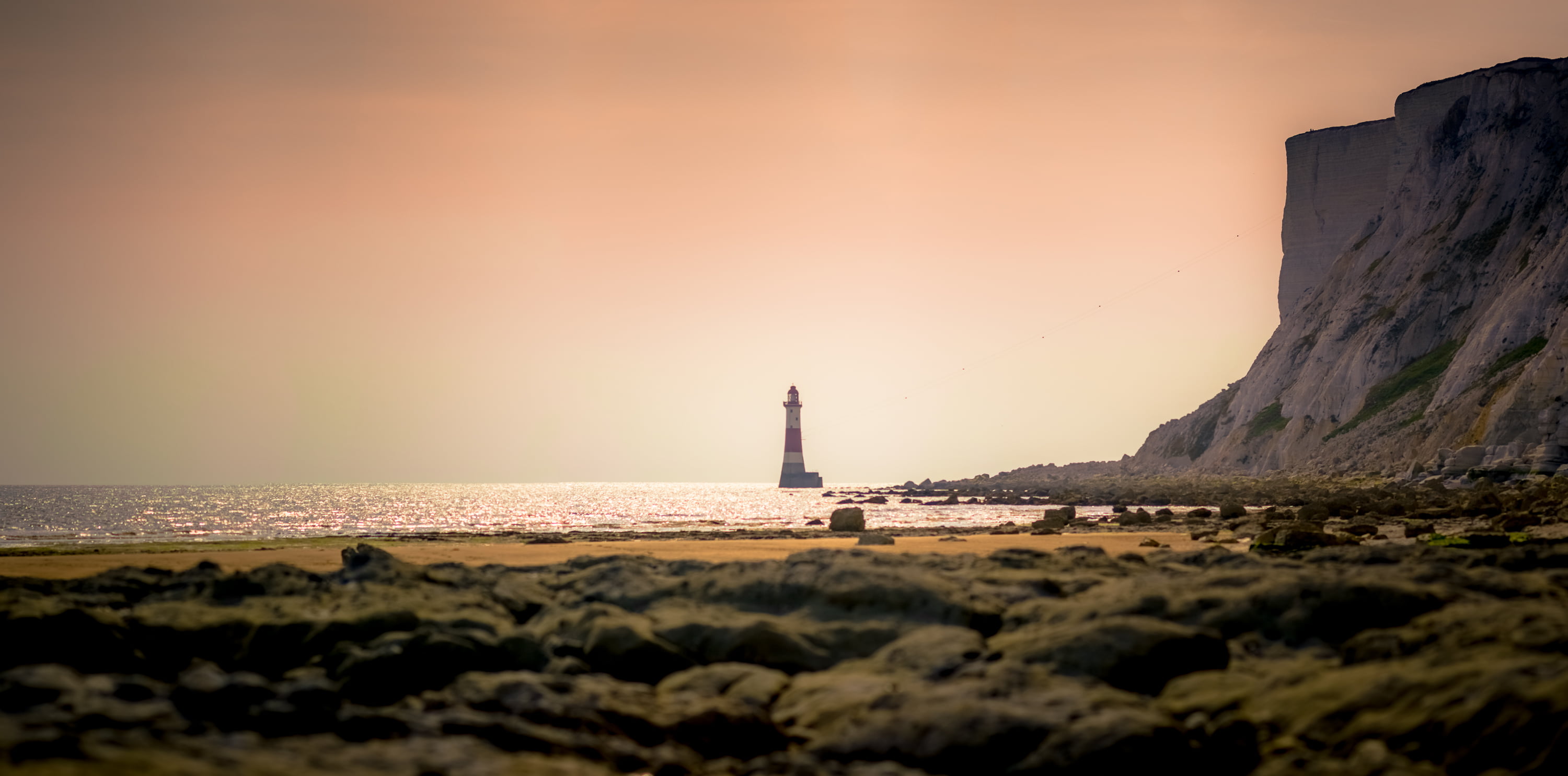 Lighthouse near shore during daytime, beachy head lighthouse