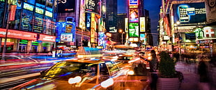 assorted plastic toy cars with boxes, neon, street, city, New York City