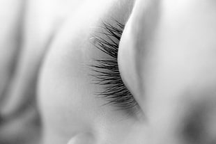 grayscale photography of human eyelashes