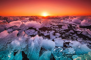 landscape photography of ice bergs during golden hour