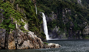 waterfalls on black and green mountain HD wallpaper