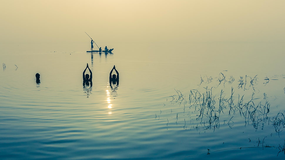 three people at the lake near boat HD wallpaper