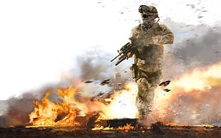 solider holding gun near explosion