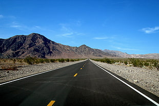 black concrete road during daytime, american