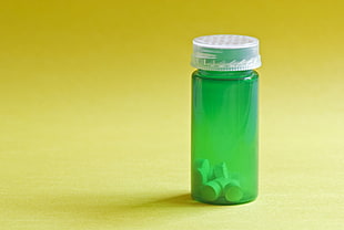 green translucent glass medicine bottle