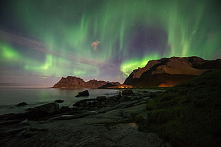 Aurora Borealis over mountain, aurorae, landscape HD wallpaper