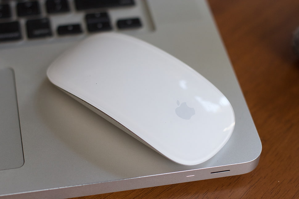 Apple Magic mouse on top of MacBook Pro HD wallpaper