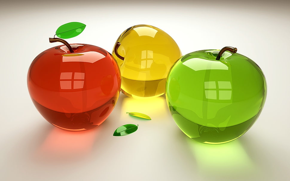 three glass apples on white surface HD wallpaper