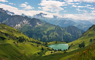 lake near mountain next to mountain range under white clouds during daytime HD wallpaper