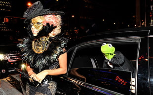woman wearing feather accent gown beside vehicle with Muppets green frog puppet HD wallpaper