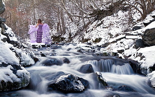 time lapse photography of raging water during winter