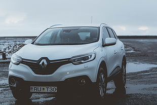 white Renault five-door hatchback