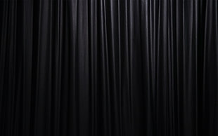 closeup photo of black satin curtain