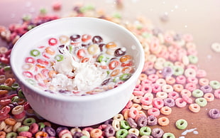 assorted color fruit loops cereal with milk and bowl
