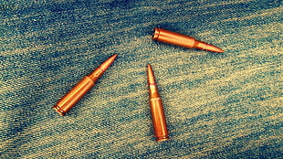three brass bullets