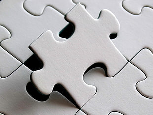 close up photography of gray puzzle piece HD wallpaper