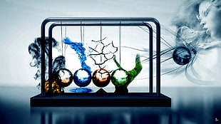 black metal framed colored stringed ball decor creating colored smokes