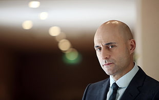man wearing black formal suit jacket