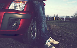 person in blue jeans leaning on red car, Ford, Nike, car, ford fusion