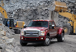 red Ford F-250 crew-cab pickup truck near heavy equipment on quarry site HD wallpaper