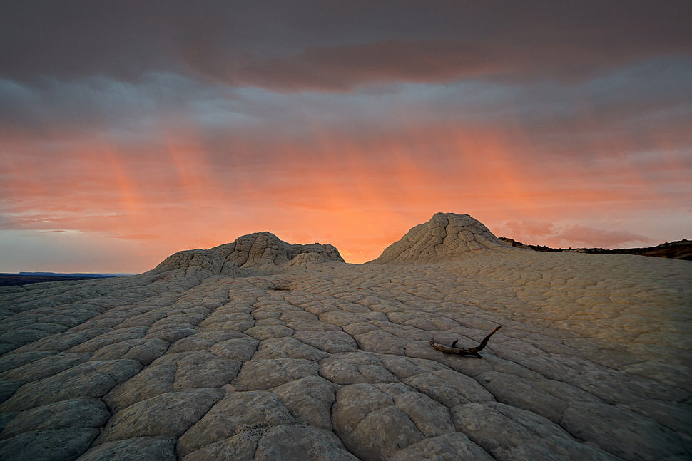 sunset rays above cloudy sky and dessert field HD wallpaper