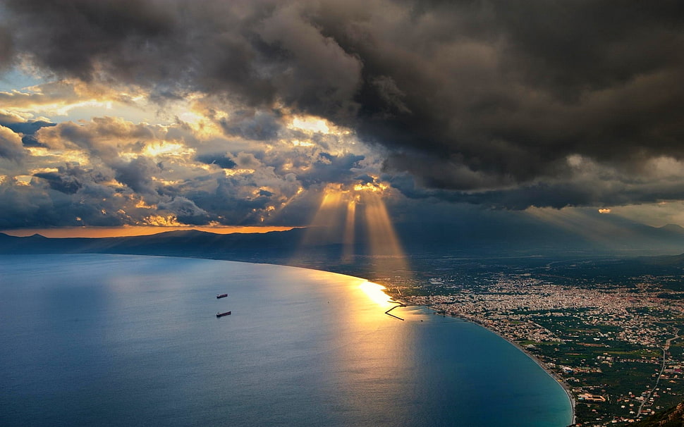 aerial photography of body of water, nature, landscape, sunset, sun rays HD wallpaper