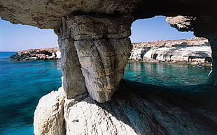 brown rock formation, cave, rock, sea, cliff
