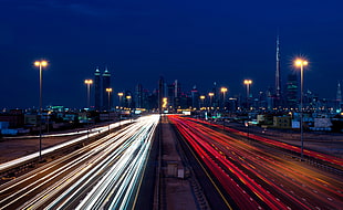 time lapse photography of city highway with cars traveling during nighttime HD wallpaper