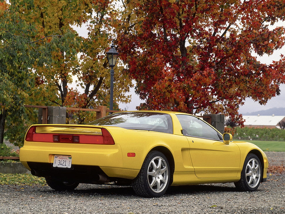yellow Chevrolet Corvette C5 parked on grey gravel HD wallpaper
