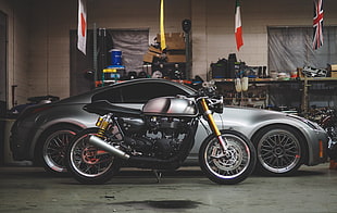gray and black sports bike and gray Nissan 350z in garage