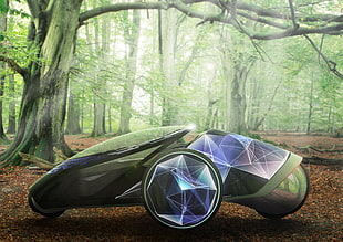 gray and black 3-wheel concept car in the middle of tall trees