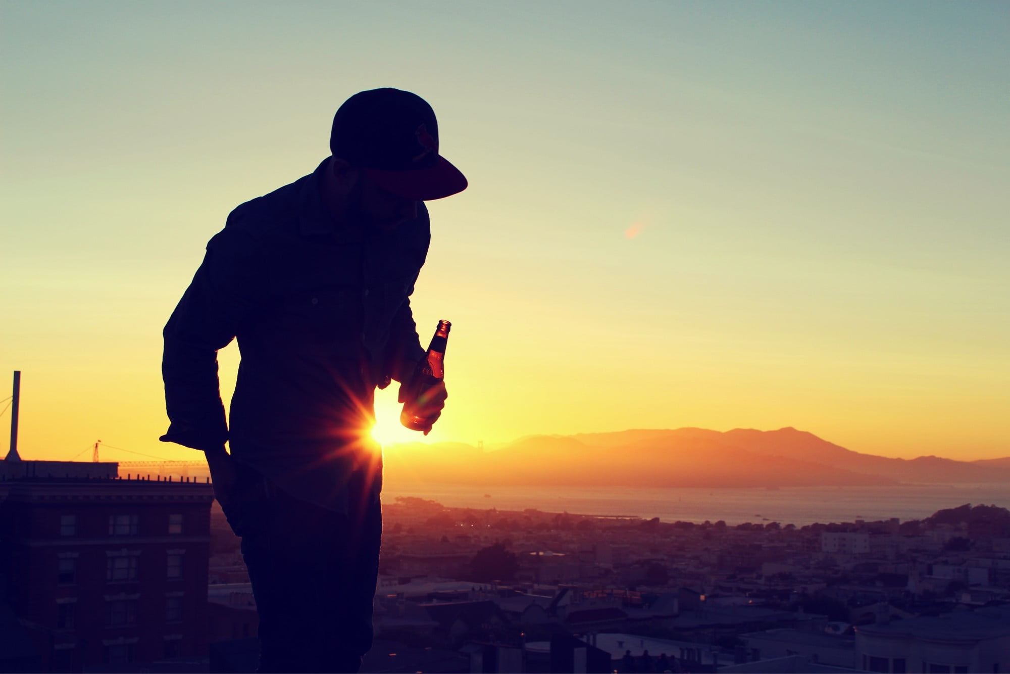 silhouette of a man, beer, silhouette, sunlight, cityscape