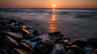 rocky shores across sea during sunset, key west, florida HD wallpaper