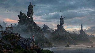 mountains with statues during daytime