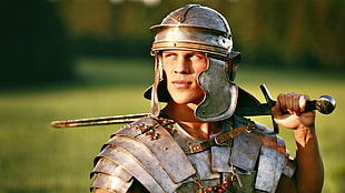 shallow focus photography of man in medieval knight costume