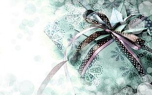 black and purple ribbon wrapped on green floral textile