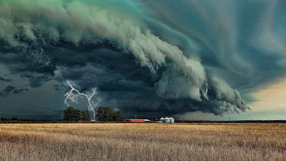 rain cloud with lightning over brown fields HD wallpaper