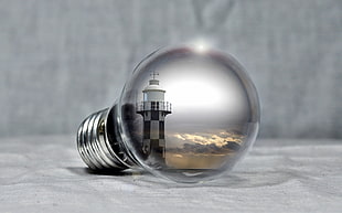 light bulb with a view of lighthouse